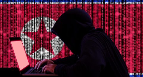 Hacker-with-computer-on-background-with-north-korea-flag-1536x1024